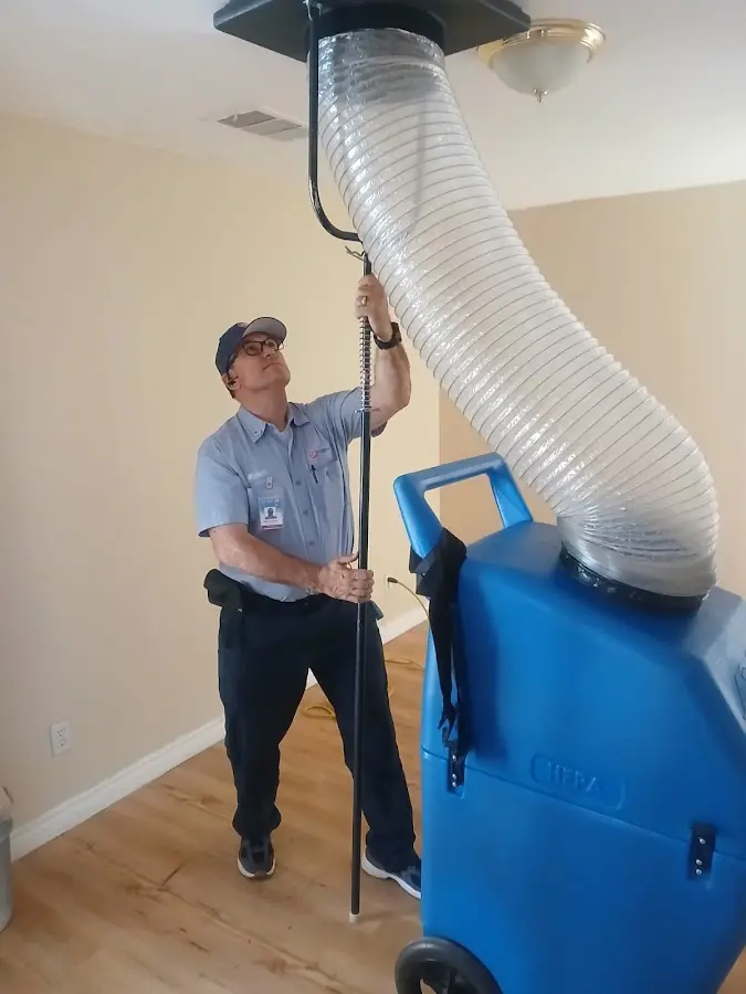 Furnace Tune-Up technician using HEPA equipment in Presque Isle
